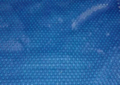 BACHE A BULLES PISCINE BOIS DAKOTA BORDEE 4 COTES